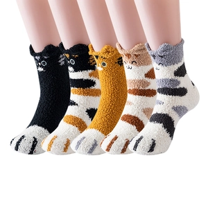 Close-up of five colorful coral fleece cat socks with 3D ears and bionic paw prints
