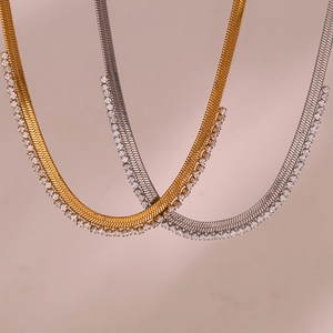 Gold and silver flat herringbone chain necklace with micro-pave cubic zirconia accents