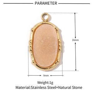 Macro detail of oval orange natural stone pendant in gold stainless steel frame