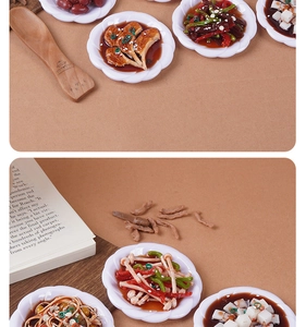 Macro detail of 8cm miniature Chinese food models including stir-fry on white lace plates