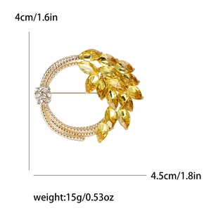 Elegant gold wheat ear wreath brooch with yellow gemstones and white crystal pave ball