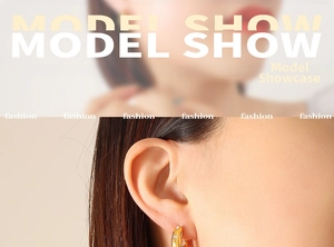 Detail show of 18K gold C-shaped hoop earrings with inlaid zircons on a model