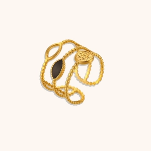 Detailed close-up of 18K gold plated multi-layer ring with black marquise gem and relief sun