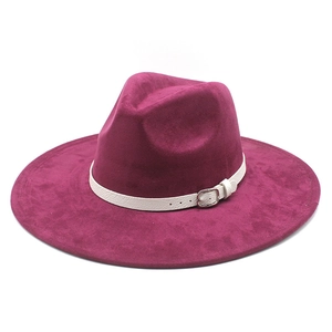 Detail of fuchsia wide brim felt hat with white leather band and silver buckle