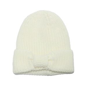 Cozy cream winter knit beanie for children featuring a large decorative bow on the cuff