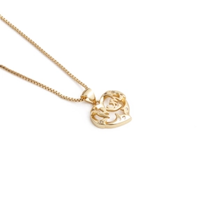 Detailed close-up of gold heart pendant with MOM engraving on a box chain necklace