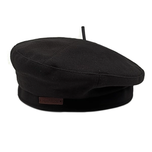 Classic black wool beret for women with a brown Hand Made leather label on white background