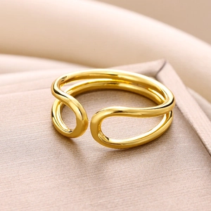 Macro detail of gold plated double layer water drop ring with a polished wavy finish