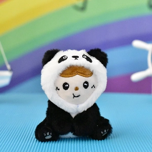 Close-up of a cute plush doll wearing a fluffy black and white panda hood costume.