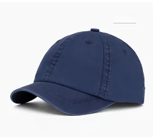 Close-up of navy blue washed cotton baseball cap with reinforced stitching and eyelets