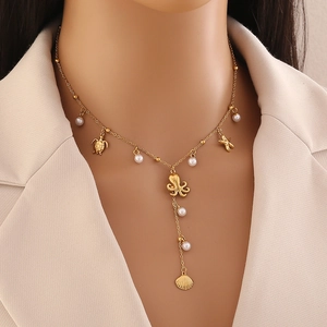 Gold ocean pendant necklace with pearls, starfish, and sea turtle charms for women