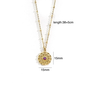 Detail of 14K gold 316L stainless steel necklace with purple gemstone disc pendant