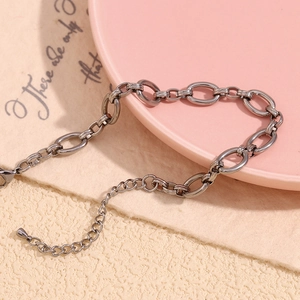 Detail of chunky oval link chain in gunmetal grey with adjustable lobster clasp and extender