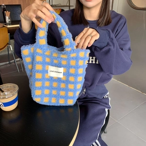 Close-up of blue and yellow checkerboard sherpa tote bag with LOVE SOZAKKA logo