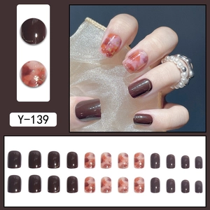 Brown and pink gradient press-on nails with golden foil details in short square shape
