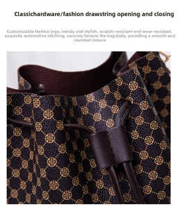 Close-up of drawstring closure and gold hardware on a textured bucket bag