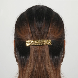Vintage rectangle gold hair clip with embossed floral sunflower patterns and antique finish