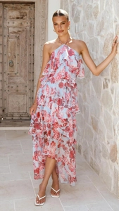 Detailed close-up of light blue floral chiffon dress with elegant tiered ruffle layers