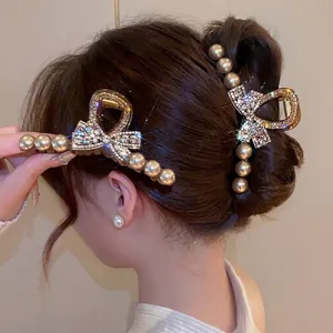 Elegant large shark hair claw clip set with white pearls and sparkling rhinestones