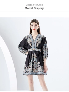 Detail of V-neck bohemian print mini dress with lantern sleeves and floral patterns
