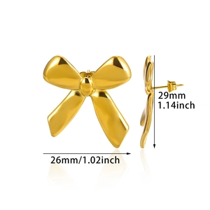 Detailed view showing dimensions of golden bow earrings in 26mm width and 29mm height
