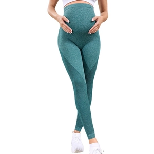 Seamless maternity yoga leggings in dark green with mesh breathable details and belly support