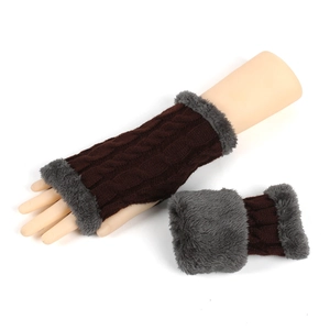 Detail of dark brown cable knit fingerless gloves with grey faux fur trim on model