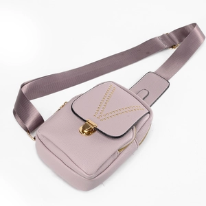 Purple studded chest bag for women with gold metal buckle and wide nylon strap on white background