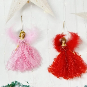 Detail of pink and red Christmas angel ornaments with feather skirts and resin faces