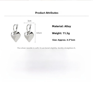 Silver heart hoop earrings detail with 4.5cm height and 3cm width measurements