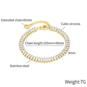 Detail of gold stainless steel tennis bracelet with 45mm extension chain and cubic zirconia