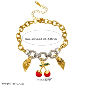 Gold and silver mixed chain bracelet featuring cherry, leaf and starfish charms