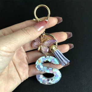Handheld purple butterfly and letter S keychain with sequins and tassel charm