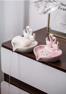 Detail showing self-draining swan ceramic soap dish with pearlescent glaze finish