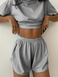 Detail of grey and white striped knit loungewear set with soft texture and relaxed fit