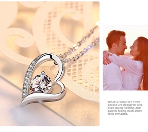 Macro detail of S925 sterling silver heart pendant necklace with shimmering zircon stones