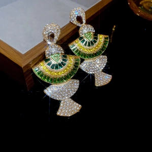 Detailed macro shot of luxury fan-shaped earrings with colorful sparkling gemstones