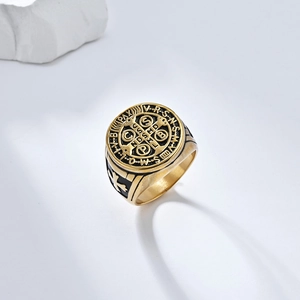 Detailed view of Saint Benedict vintage gold cross ring with black enamel engraving