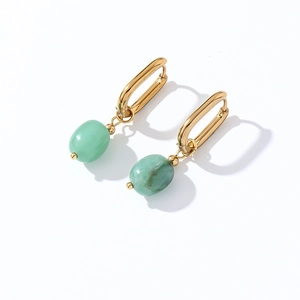 Detailed close-up of gold rectangle hoop earrings with emerald green natural stone charms