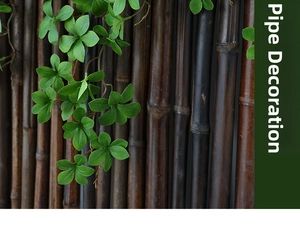 Close-up of green artificial foliage vines with detailed leaf texture on a decorative pipe
