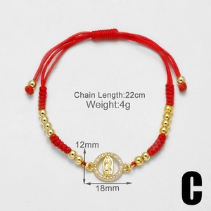Macro shot of 22cm red braided bracelet with 18k gold Virgin Mary pendant and dimensions