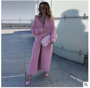Pink oversized knit cardigan with lapel collar and large pockets for stylish winter fashion
