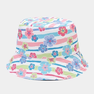 Close-up of tropical hibiscus floral print and colorful artistic stripes on cotton bucket hat