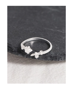 Macro shot of S925 sterling silver star ring featuring a polished metallic finish