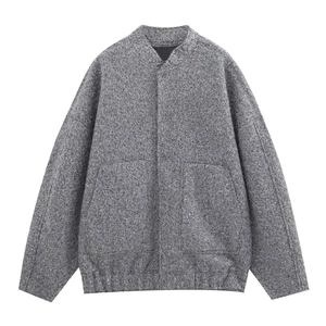 Macro shot of grey marl wool texture and hidden placket detail on bomber jacket
