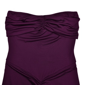 Detail of ruched bodice and V-shaped waist seam on a dark purple strapless dress