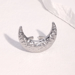 Minimalist silver hammer-textured crescent moon open ring on clean white backdrop