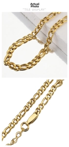 Detail of 18k gold plated stainless steel Figaro chain with secure lobster clasp closure