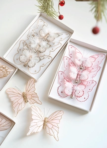 Detail of Christmas butterfly hair clips with glitter and mesh in a gift box