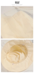 Detail showing the inner lining, sweatband and textured fabric of the beige bucket sun hat